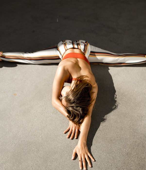 Woman in a graceful, calm yoga pose, embodying body harmony and inner peace.
